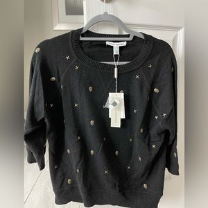 Autumn cashmere. Skull and x studded sweater in black.